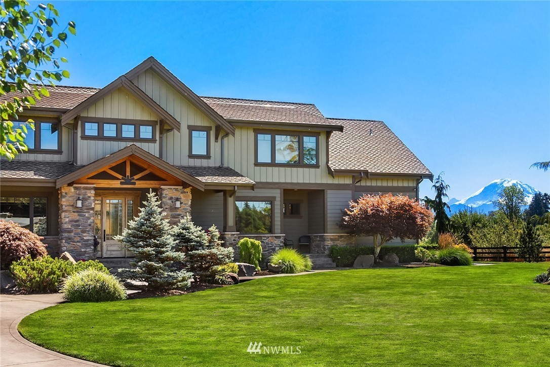 The Wabash Aussies home with a landscaped lawn and Mount Rainier in the distance